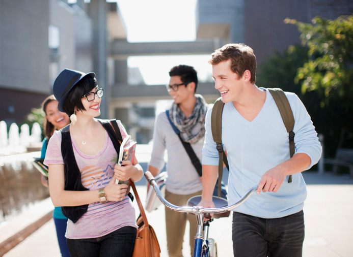 Group of students walking together outdoors on campus